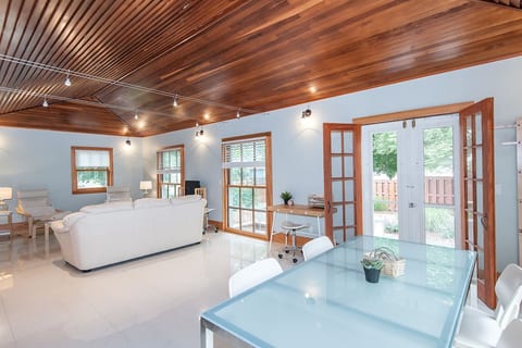 gathering space, dining table, desk and television