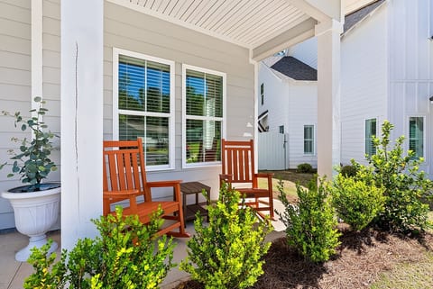 Warm and inviting front porch with rockers to relax