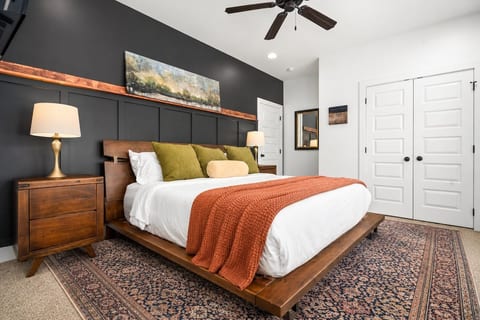 Primary bedroom has updated decor, gigantic closet, and ensuite bathroom with double sink vanity and walk-in shower