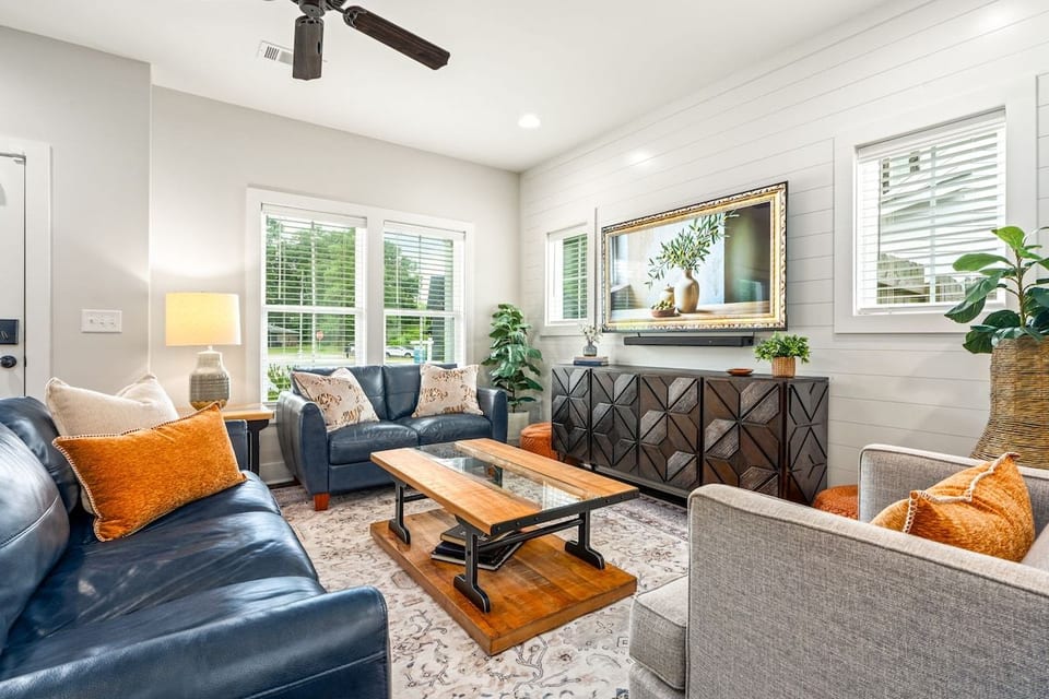Living room has lots of seating for watching big games and movies on the 65" smart TV, playing games, or visiting