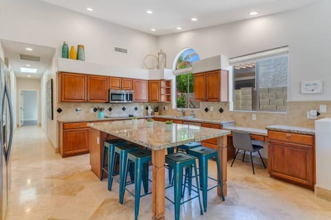 Gather around the enormous island for breakfast, cocktails, or a family dinner in our kitchen. When the pool is full, hit the coffee bar and desk to get some work done while it's quiet!