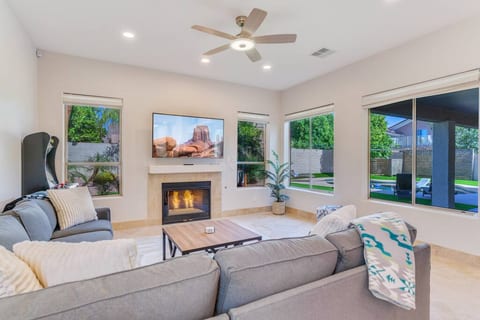 The family room has an oversize sectional, tons of warm blankets, and a gas fire to warm you up when the temps drop outside. Great room concept with kitchen attached and arcade games for the kids.