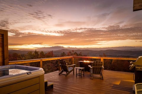 Private deck: hot tub, cold plunge, shower, grill, and fire table overlooking Cherokee National Forest