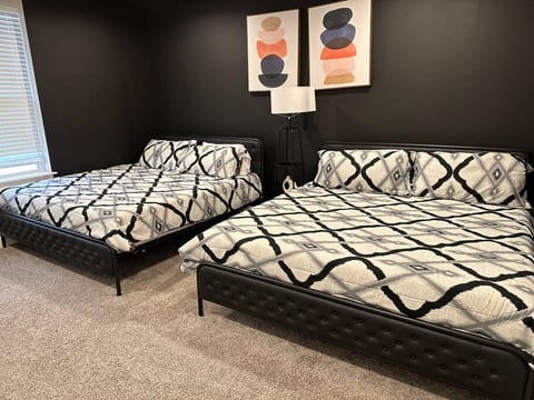 Master bedrrom with 2 king-sized beds.