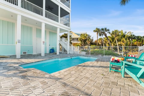 Pool complete with outdoor shower and foot washers near both steps