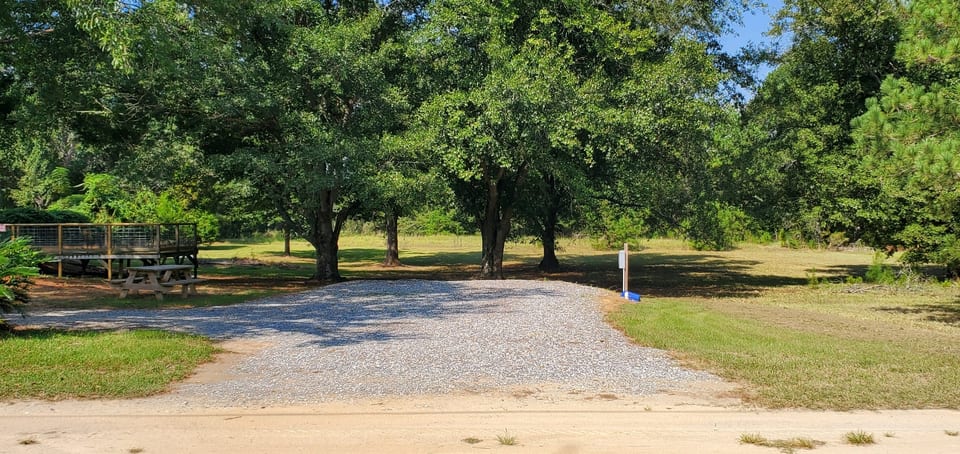 Large level pad with plenty of shade and a deck for relaxing and elevated wildlife viewing.