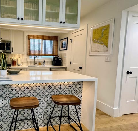 Kitchen Island with seating and beautiful lighting to set the right mood.