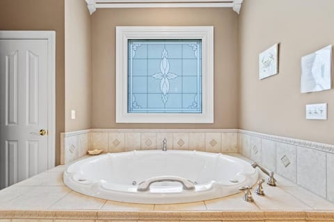 2-person jacuzzi tub in master bath on main floor.