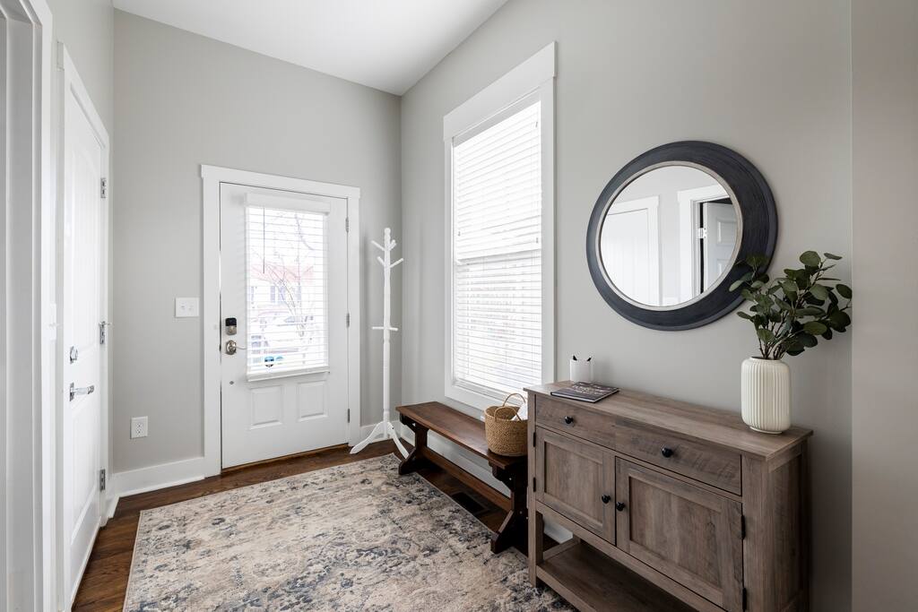 Entry way with coat rack, bench to take off shoes, slippers provided, and a guest book full of recommendations from past guests.