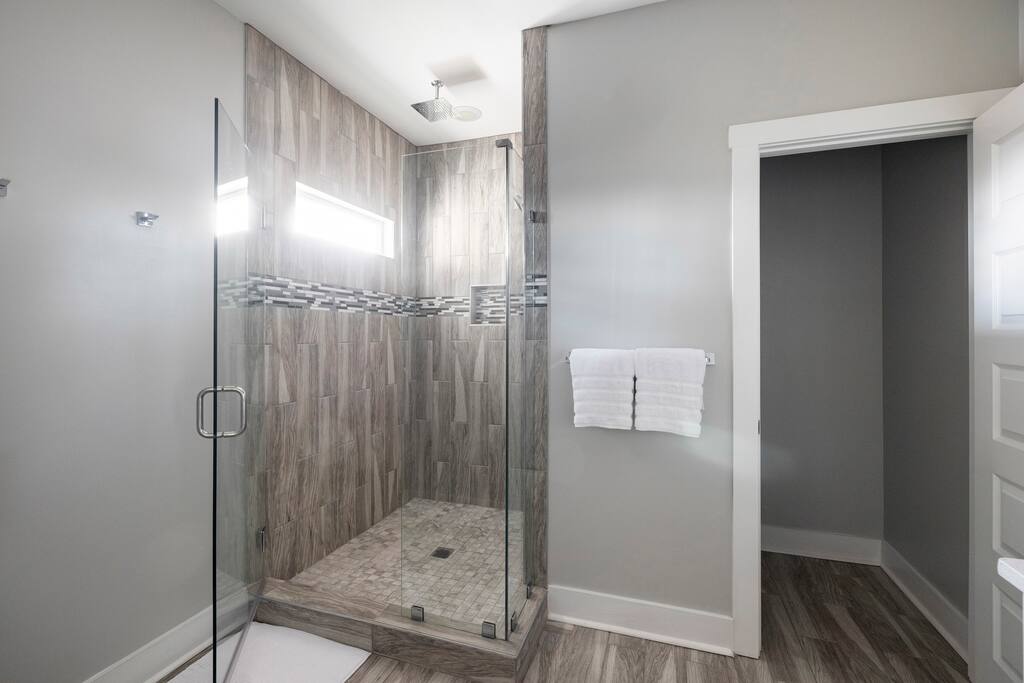 Luxurious walk-in shower with rainfall shower head. 
