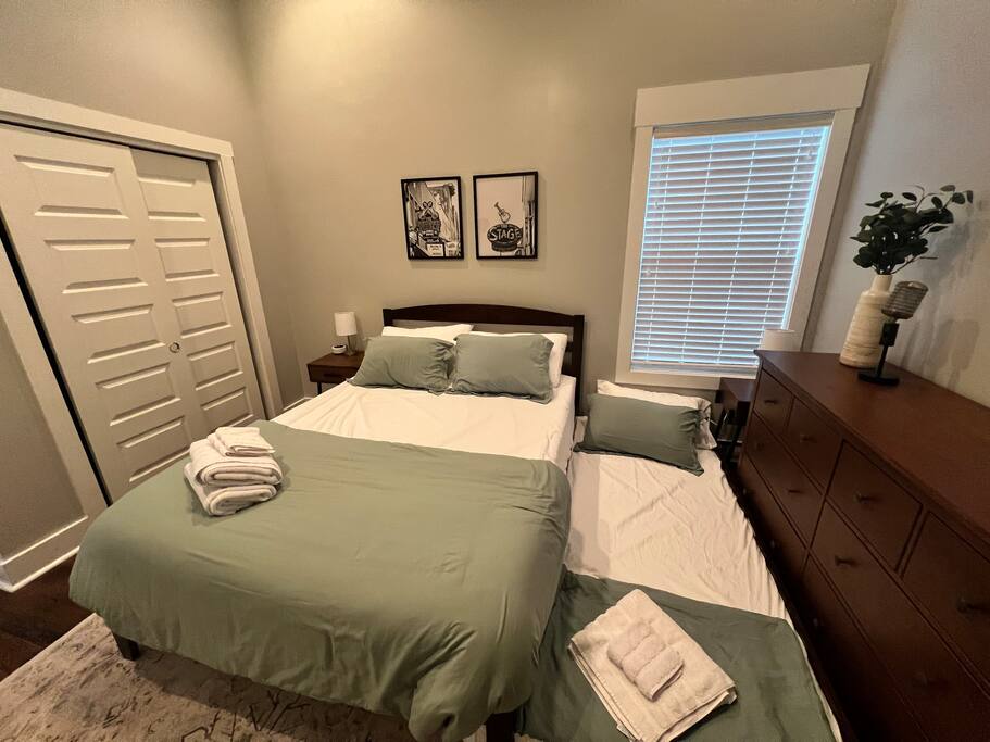 New solid wood bed frame with Queen Purple mattress and Twin XL pullout trundle bed. Sleep 3!