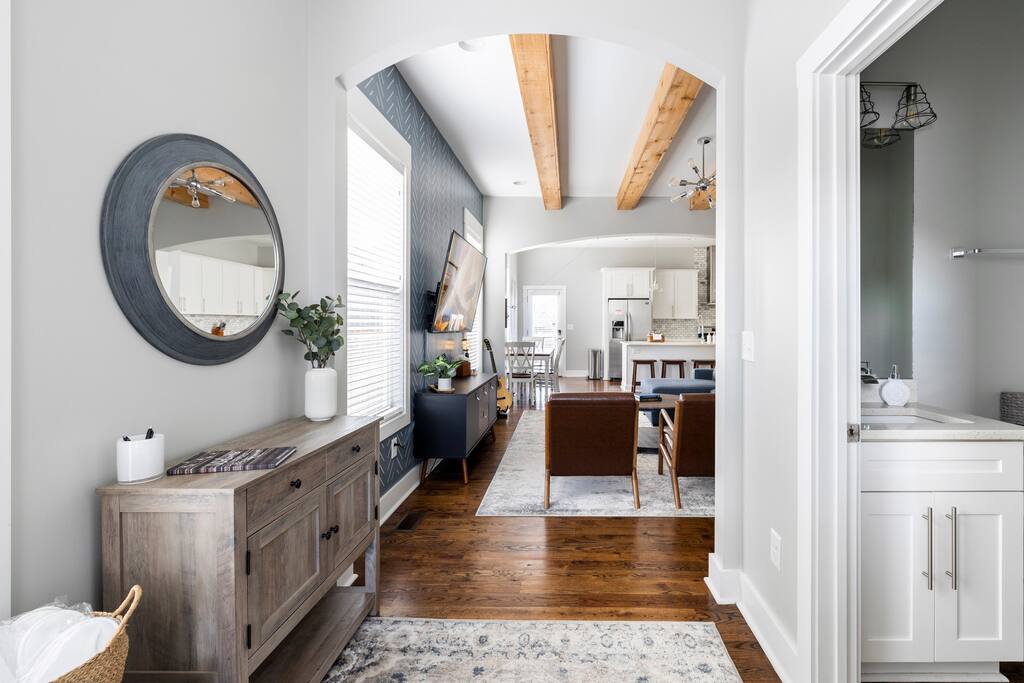 Entry way view with half bathroom on right.