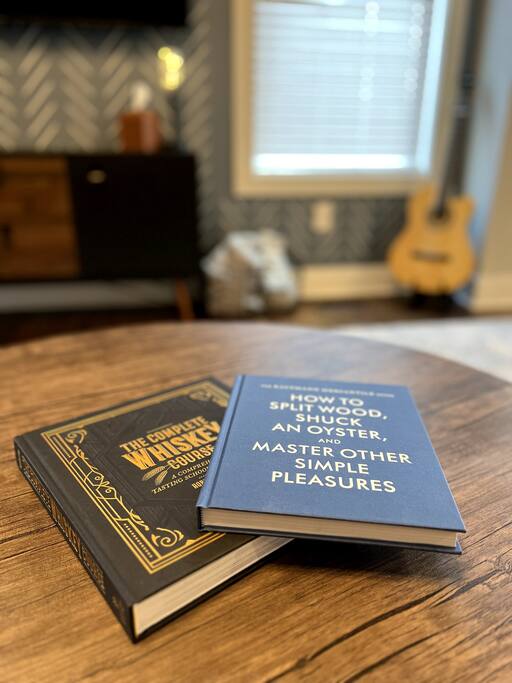 Coffee table books. 'The Complete Whiskey Course' & 'How To Split Wood, Shuck An Oyster and Master Other Simple Pleasures'