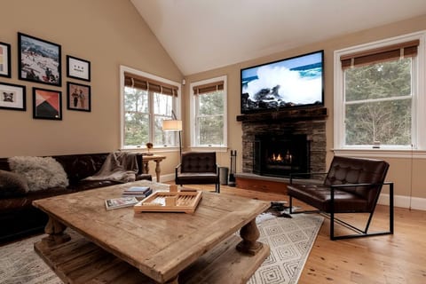 Living room with wood burning fireplace