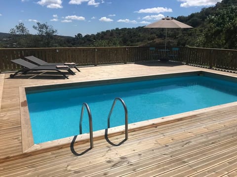 Pool deck with view over Olive valley