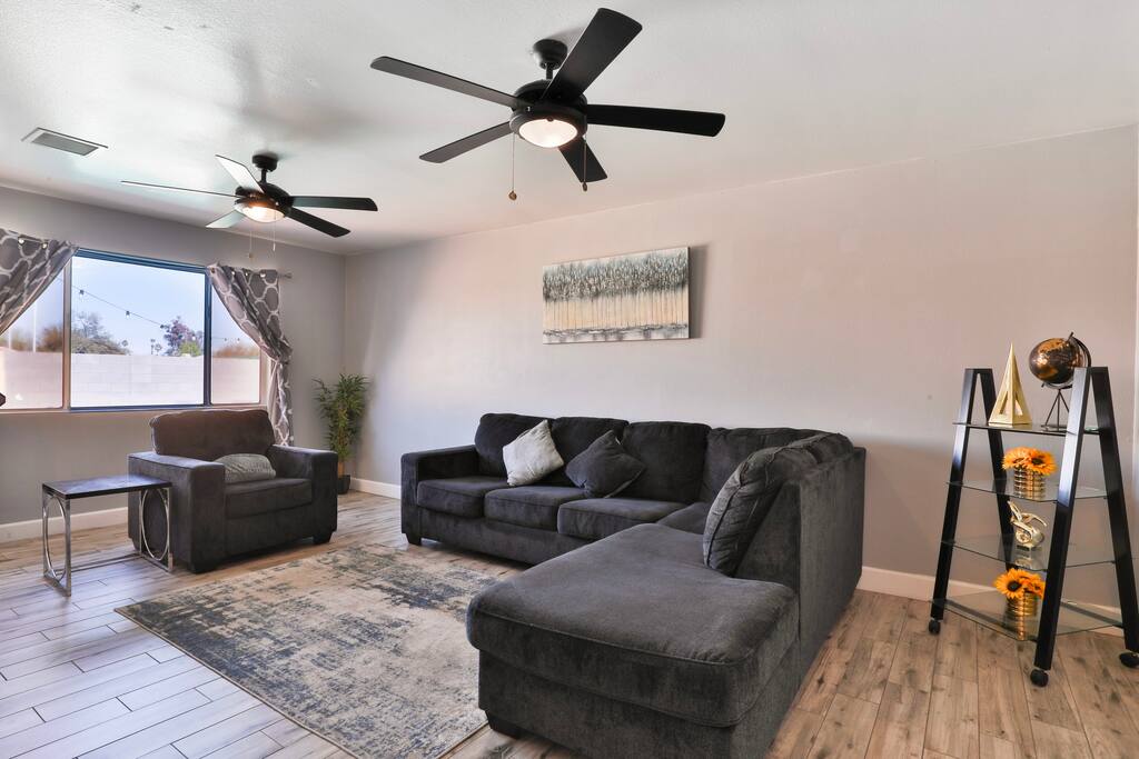 Living room with comfortable couch for your group to watch TV