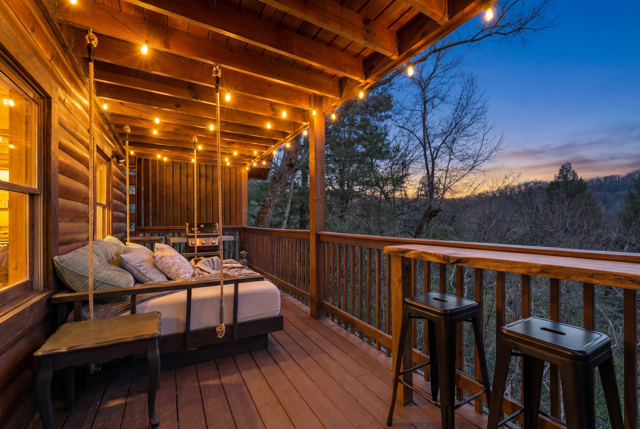 Swinging bed on main level deck Sleep in the Clouds