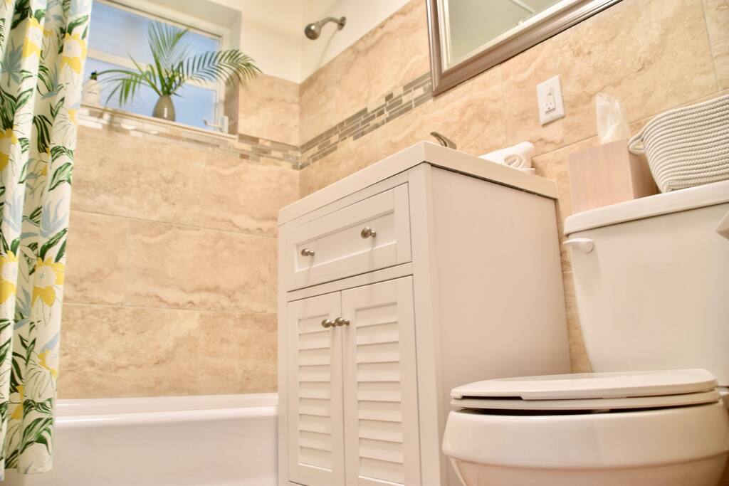 Bathroom with bathtub and shower