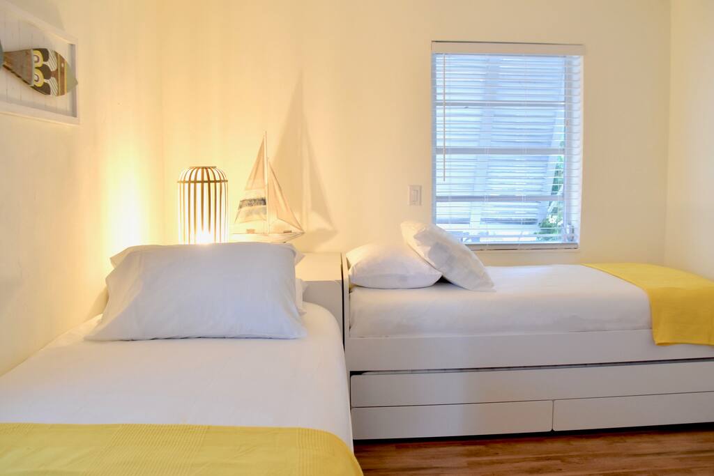 Yellow room has 2 Twin beds and a trundle bed