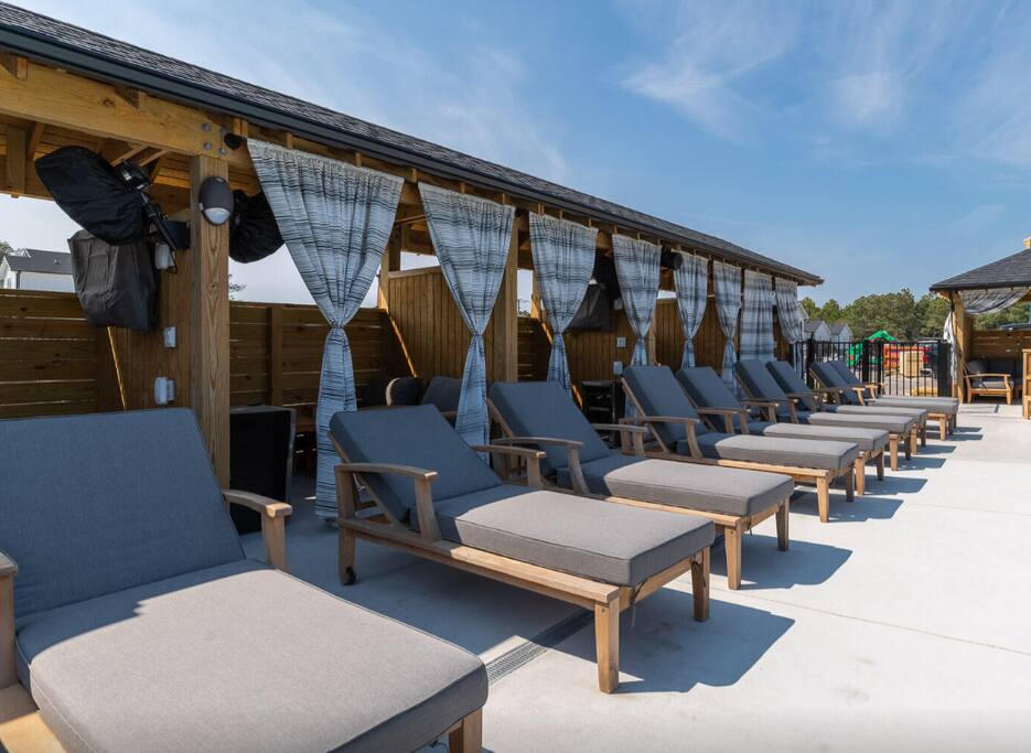 Come lounge by the pool and catch some sunshine!

The Cabanas are for rent through community HOA.  They are equipped with fan, tv, beverage refrigerator, outlets, chairs, and table.  Cabanas come in three sizes. Message for pricing. - SunRise 'n Shine Beach House, OBX - Corolla