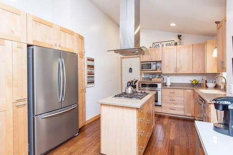 Updated modern and bright kitchen with gas stove, dishwasher, nice oven, microwave and fully stalked pantry. Stainless appliances, full refrigerator.