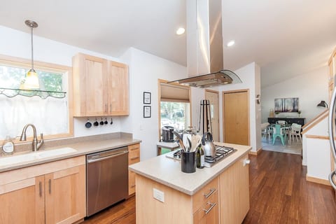 Updated modern and bright kitchen with gas stove, dishwasher, nice oven, microwave and fully stalked pantry. Stainless appliances, full refrigerator.