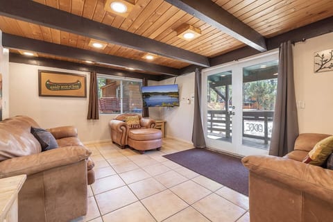 Enjoy family time in the large open concept living room featuring french doors for an indoor-outdoor experience