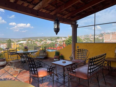 Colonial home with rooftop view