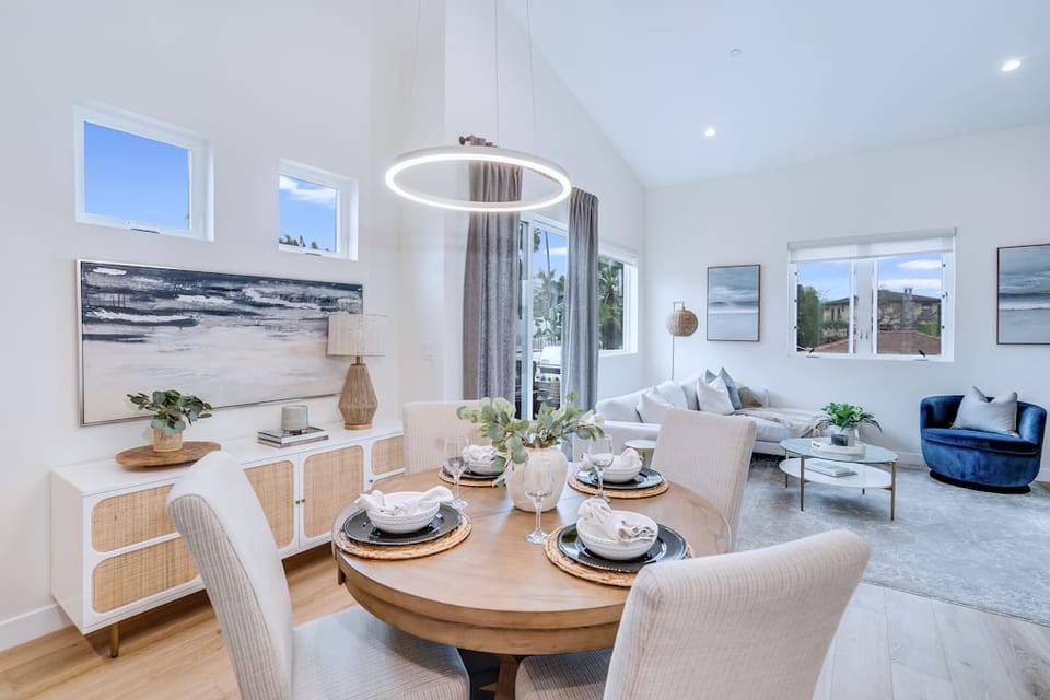 New coastal modern furniture and decor in main living area and dining room - off of west facing patio