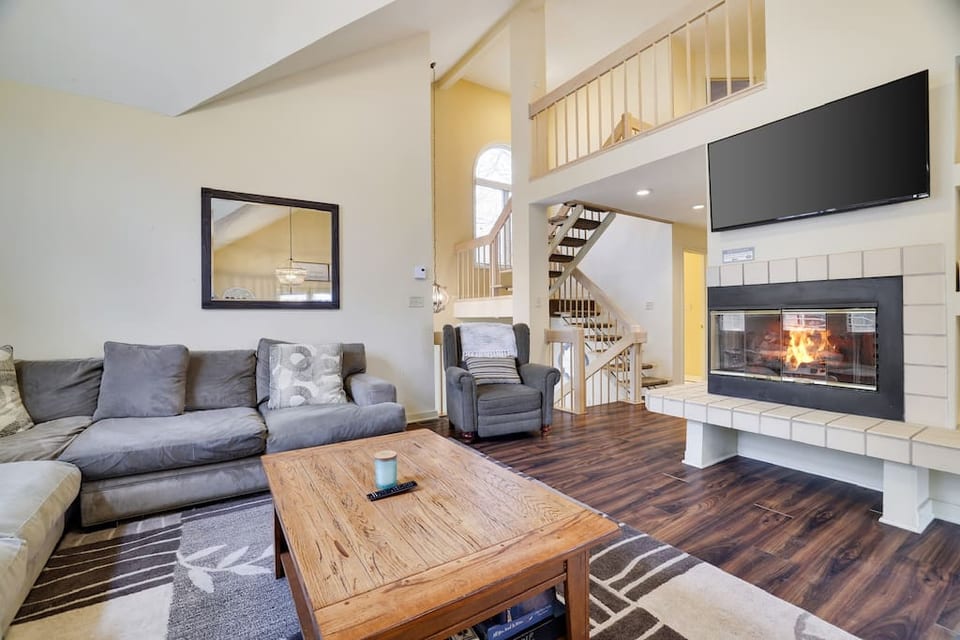 Spacious main living room (the house has two additional living spaces). Open to kitchen, with oversized couch and TV!