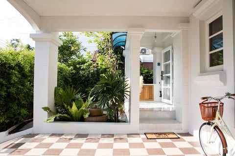 Step into tranquility with our home's dedicated carport and ample street parking. Experience the ease of access and the charm of a home that greets you with lush greenery, inviting checkered pathways, and a welcoming porch.