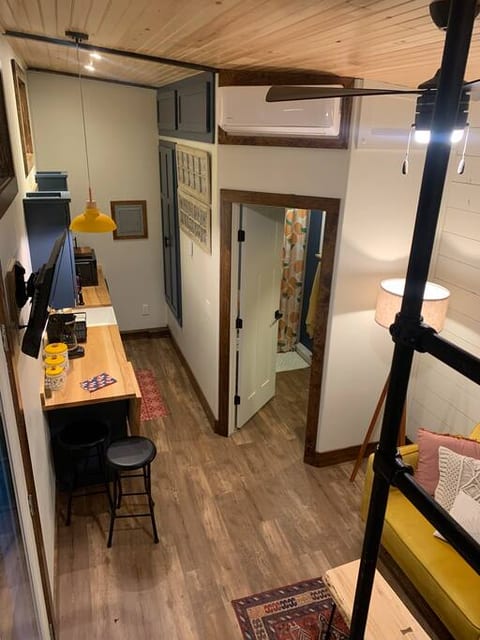 View from loft to the kitchen, living area and bathroom