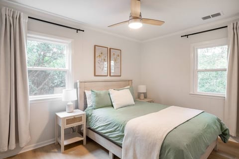 Bedroom 1 - Queen bed with blackout curtains. Luggage racks and a small dresser are located in the closet.