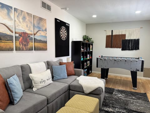 Den features fooseball, darts, puzzle and games. Kids books and comfy seating, with another smart TV