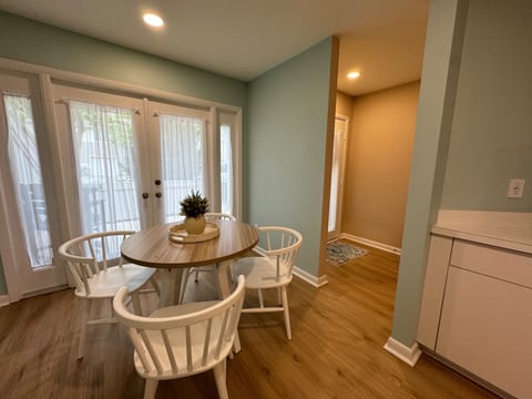 Breakfast nook with French doors that lead to the front patio.