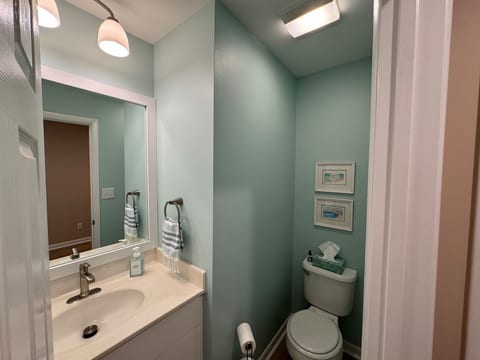 Powder room, small 1/2 bath off the entrance from the garage on the first floor.