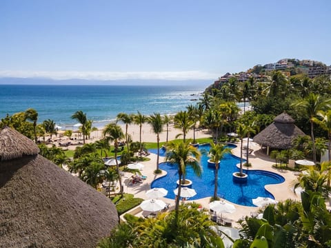 Dive into paradise at our beach resort on the Pacific Ocean. Relax by the freeform pool surrounded by swaying palm trees, where every moment is a postcard-worthy memory. Welcome to your ultimate coastal escape.