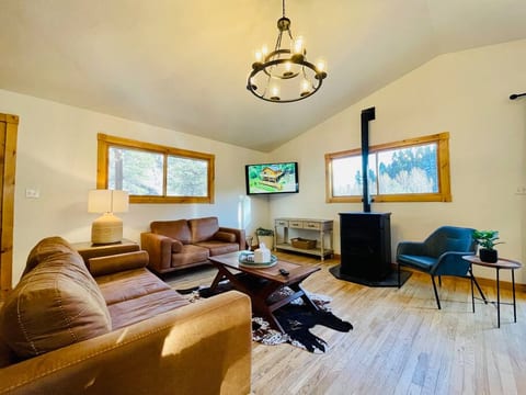Upstairs living room: 
• Sofa
• Loveseat
• Chair
• Pellet stove 
• 52” TV 
• Extra blankets