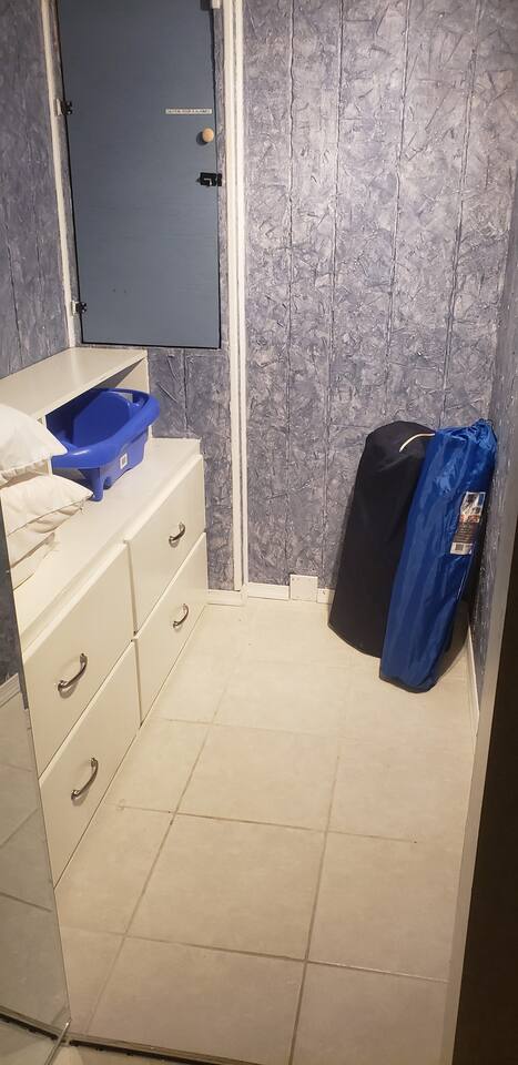 Full walk-in closet in Masterbedroom holds extra pillows, baby bathtub, portable pack n play (navy), portable high chair (blue). Plenty of storage!