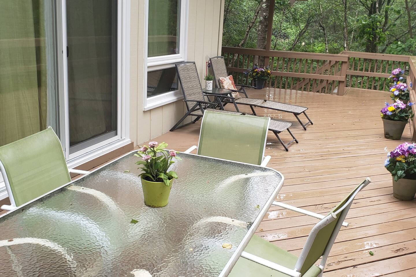 Deck i the spring after a nice mountain rain storm. Plenty of seating for lounging and enjoyment!