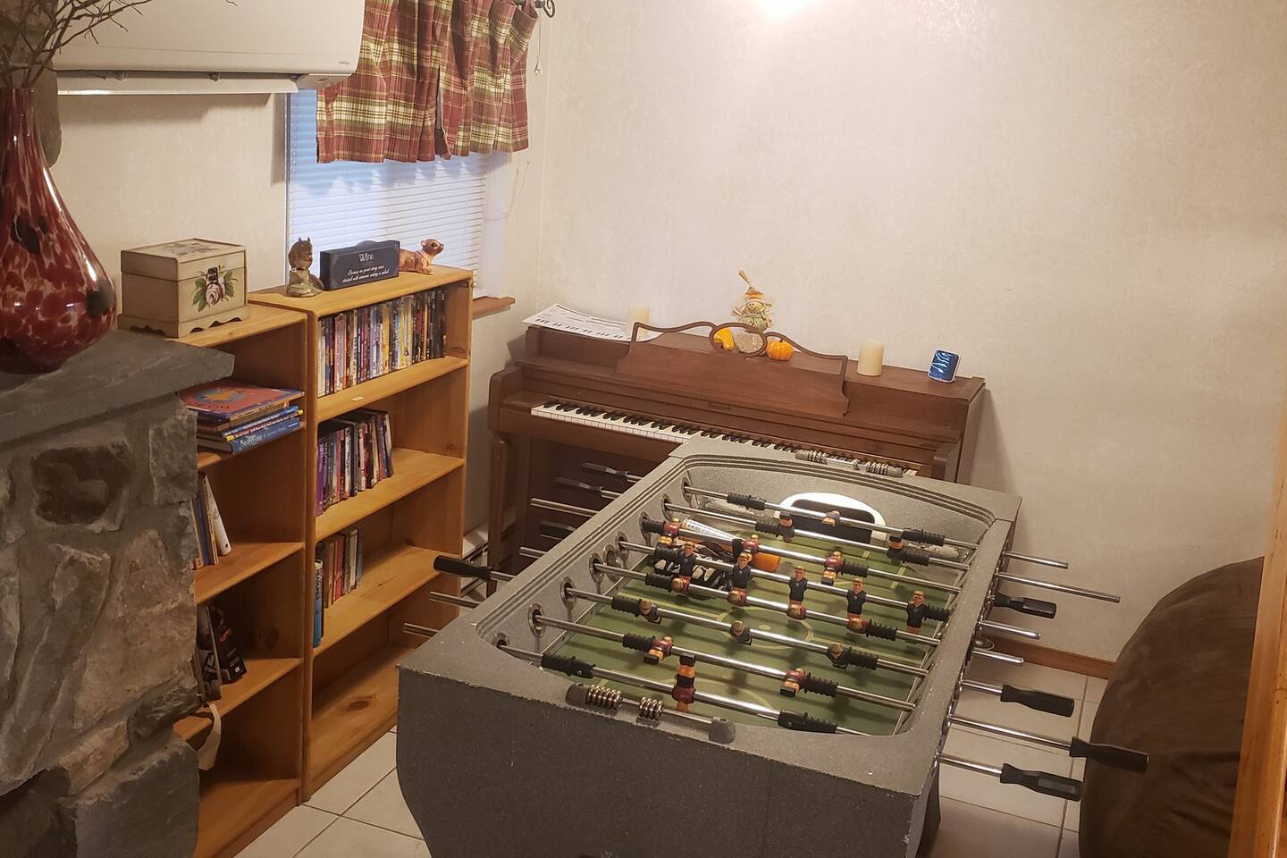 Media/Game corner in the den. Books of all kinds, DVDs of all genres, Piano, Foosball, and love sac to chill on! Plenty to do if you just want to stay in on cold days. 
