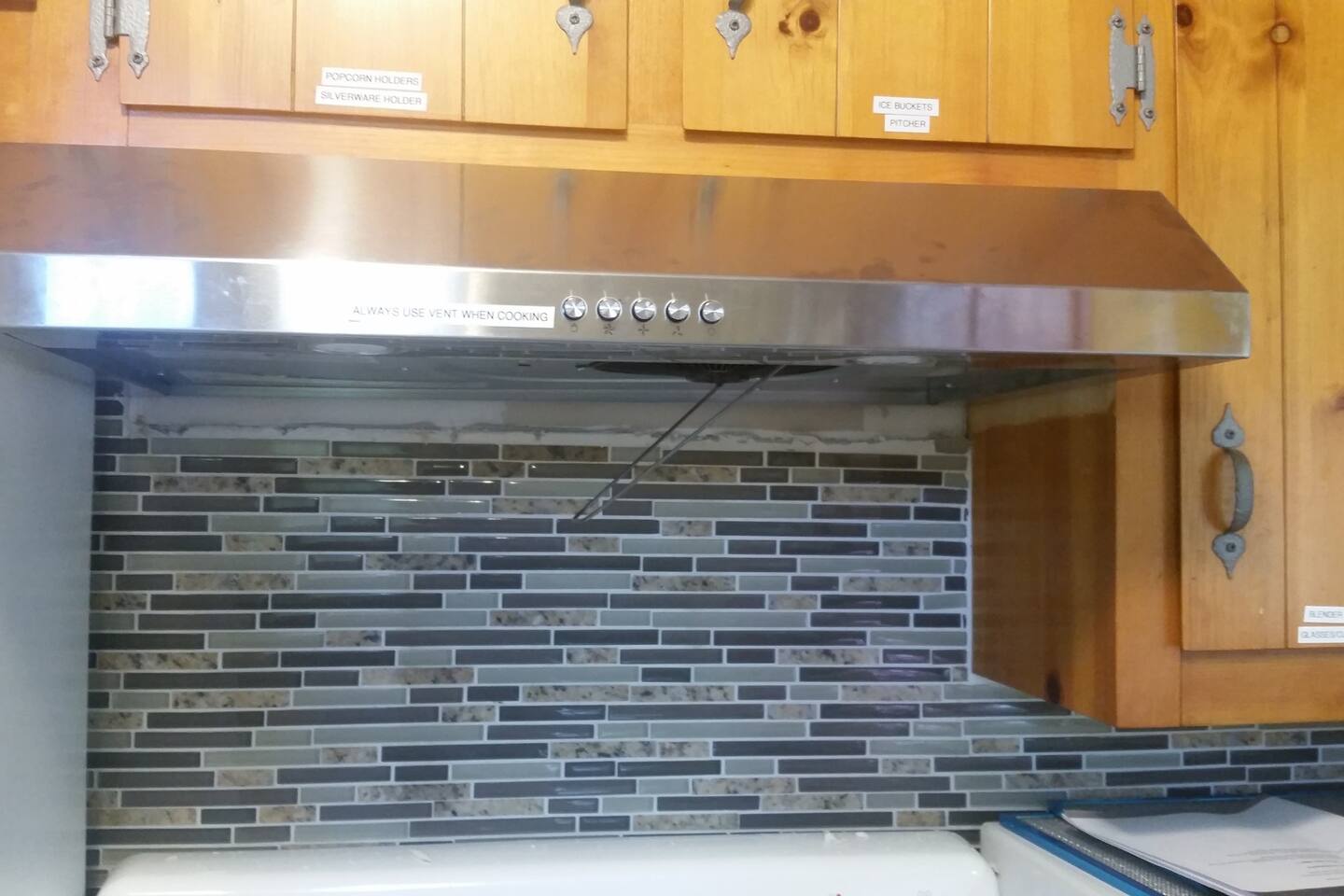 Brand new stove range with LED. All cabinets labeled for easy retrieval.