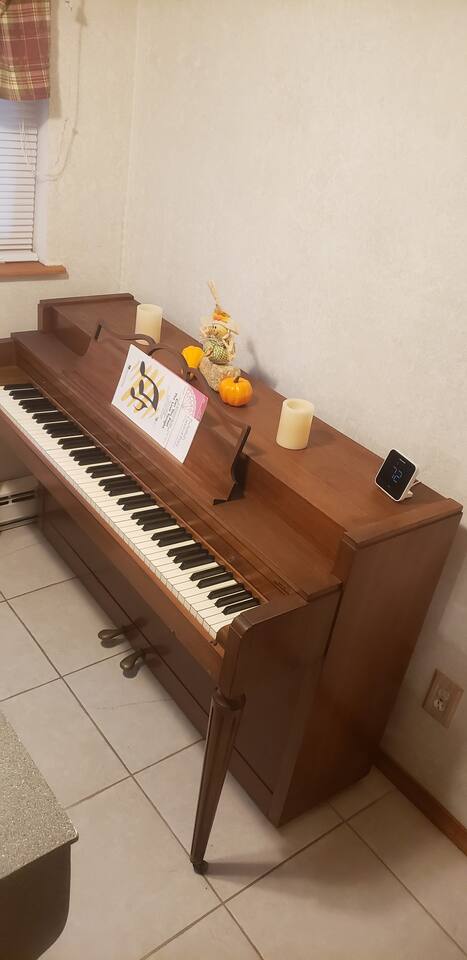 Even the piano cannot escape the holiday decors that consumes the house. Lol