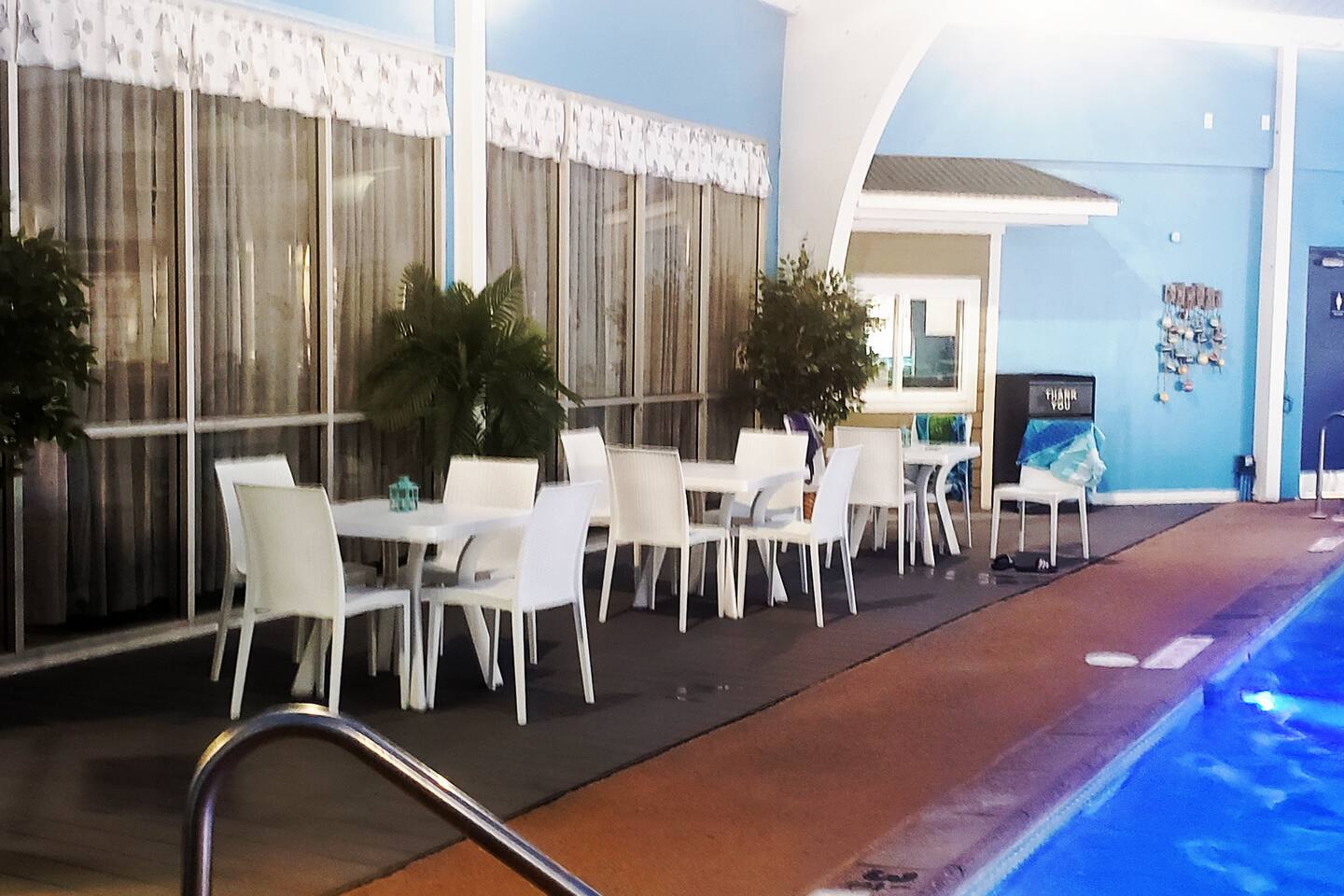 Newly renovated community center pool has plenty of comfy seating and eating space. 