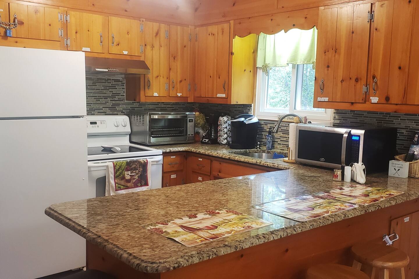 A full-sized kitchen with everything you would need for your stay. A  stove, dishwasher, fridge, stainless steel appliances, coffee makers, toasters, microwaves, blenders, dishes, cups, bakeware, silverware, etc. 