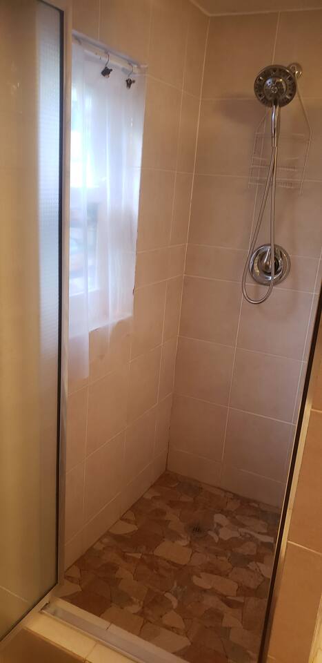 Brand new shower remodel. Feels like your showering on the rocks under a waterfall. Shower is big enough for two... go ahead we don't judge. ;)