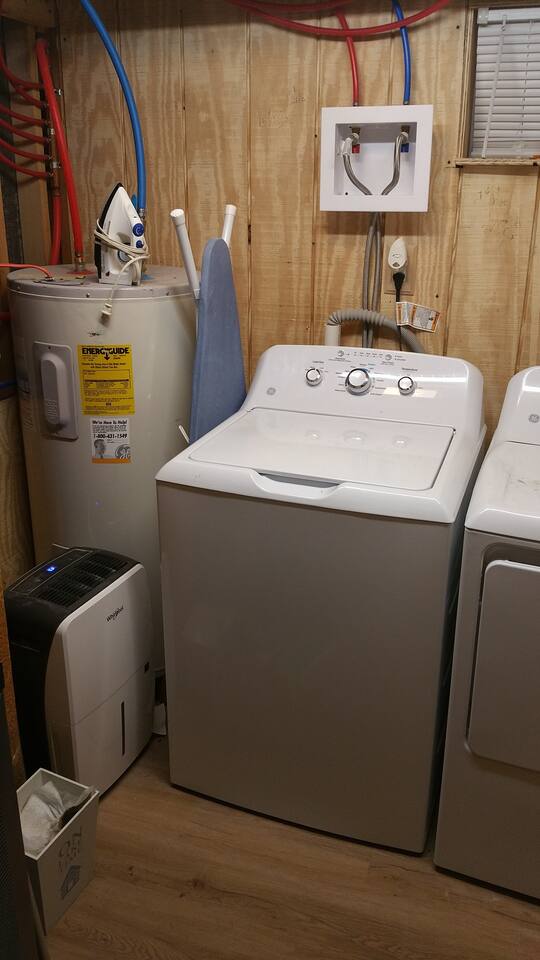 Full Laundry room for your use. Newer appliances. Large water tank, ironing board with iron, and a digital humidifier to keep the room climate controlled.