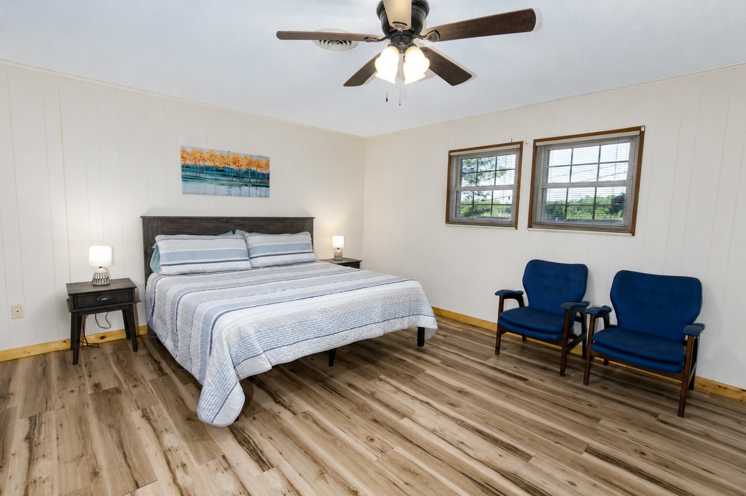 Comfy primary bedroom scenic views