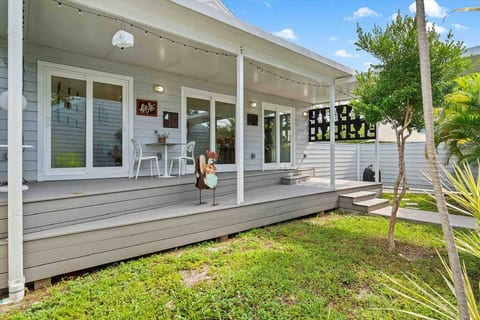A serene and private fenced in Courtyard/Backyard with an outdoor grill.