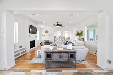 Open concept living room with comfortable seating and smart TV